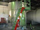 Used Krenz Approximately 10,000 Gallon Stainless Steel Storage Tank. Approximately 12' diameter x 12' straight side. Flat bottom and slight cone top. Various top openings including a 17