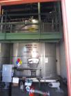 Used Krenz Approximately 7,800 Gallon Stainless Steel Storage Tank. Approximately 11' diameter x 11' straight side. Flat bottom and slight cone top. Various top openings including a 17