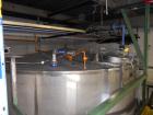Used Krenz Approximately 7,800 Gallon Stainless Steel Storage Tank. Approximately 11' diameter x 11' straight side. Flat bottom and slight cone top. Various top openings including a 17