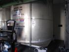 Used Krenz Approximately 7,800 Gallon Stainless Steel Storage Tank. Approximately 11' diameter x 11' straight side. Flat bottom and slight cone top. Various top openings including a 17