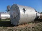 Used Saracco Tank & Mfg Approximately 8,500 Gallon Stainless Steel Storage Tank. Approximately 11' diameter x 12' straight side. Flat bottom and slight cone top. Various top openings including a 17