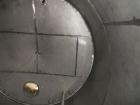 Used Saracco Tank & Mfg Approximately 8,500 Gallon Stainless Steel Storage Tank. Approximately 11' diameter x 12' straight side. Flat bottom and slight cone top. Various top openings including a 17