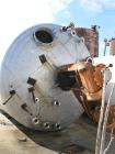 Used Master Craft, 10,000 gallons vertical T304 stainless steel tank, heated with internal pipe coil. Tank is rated for 15 psi at 250 degree F. internal. Has bank of full coil, approximately 10 turns...