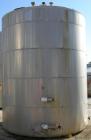 USED: Metal Equipment tank, approximately 7,000 gallons, stainless steel. Insulated. 10' diameter x 12' straight side. Flat bottom, dish top.
