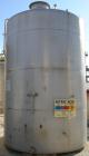 USED: Metal Equipment tank, approximately 8,000 gallons, stainless steel. 10' diameter x 14' straight side. Dish top, flat bottom. Misc top openings. 2