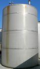 USED: Metal Equipment tank, approximately 8,000 gallons, stainless steel. 10' diameter x 14' straight side. Dish top, flat bottom. Misc top openings. 2
