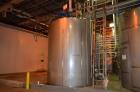 Used- Approximately 9,110 Gallon Vertical Jacketed Stainless Steel Tank. Manufacturer: Mueller. Jacket rated at 150 psi at 1...