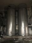 Used- Mueller 6000 Gallon Vertical 316 Stainless Steel Jacketed Tank. Sanitary polished, interior, 7'4