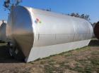 Used Mueller 16,000 Gallon Stainless Steel Horizontal Storage Tank. Approximately 10'6