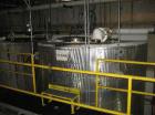 Used-Approximately 8,000 Gallon Vertical 304 Stainless Steel Tank. 9'6