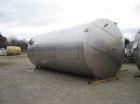 Used-Approximately 25,000 gallon vertical stainless steel tank.12' Diameter x 30' straight side.With dished top and sloped b...