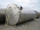 Used-Approximately 25,000 gallon vertical stainless steel tank.12' Diameter x 30' straight side.With dished top and sloped b...