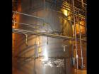 Used-Approximately 13,000 gallon vertical stainless steel tank.12'4