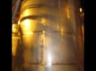 Used-Approximately 13,000 gallon vertical stainless steel tank.12'4" Diameter x 15' straight side.With flat top and flat slo...
