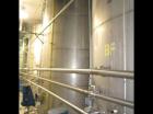 Used-Approximately 8,000 gallon vertical stainless steel tank.9'6