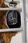 Used Tank, Approximate 22,900 Gallon, 304 Stainless Steel, Vertical. Approximate 148” diameter x 308” straight side, coned top, flat bottom. Openings top 2”, 6”, 9” hand hole with cover. Side bottom ...