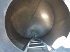 Used Tank, 5100 Gallon, 304 Stainless Steel, Vertical. Approximately 114 diameter x 116 straight side, flat top, sloped bottom. Internal ladder. Openings: top (2) 4
