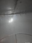 Used Tank, 5100 Gallon, 304 Stainless Steel, Vertical. Approximately 114 diameter x 116 straight side, flat top, sloped bottom. Internal ladder. Openings: top (2) 4