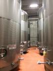 Used Paul Mueller 12,000 Gallon, White Wine Fermenting Tank, Stainless Steel, Vertical. Model DF, Slope top and bottom. 140 “ O.D. x 208-1/4” high. (2) Bands of dimple jacket on sides rated at 200 ps...