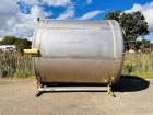 Used- Paul Mueller 6000 Gallon Stainless Steel Vertical Storage Tank. Overall Dimensions are approx. 11W x 11L x 14H. Multip...