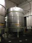 Used Perry 10,500 Gallon 316 Stainless Steel Storage Tank. Approx. 11' Diameter x 14' Straight Side. Cone Bottom. Mounted on 6 I-Beam legs. Approx. 3