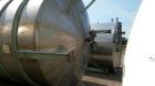 Used Perry 10,500 Gallon 316 Stainless Steel Storage Tank. Approx. 11' Diameter x 14' Straight Side. Cone Bottom. Mounted on 6 I-Beam legs. Approx. 3