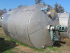 Used Saracco Tank & Mfg Approximately 5,200 Gallon Stainless Steel Storage Tank. Approximately 9' diameter x 11' straight side. Flat bottom and slight cone top. Various top openings including a 17