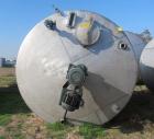 Used Saracco Tank & Mfg Approximately 5,200 Gallon Stainless Steel Storage Tank. Approximately 9' diameter x 11' straight side. Flat bottom and slight cone top. Various top openings including a 17