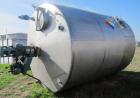 Used Saracco Tank & Mfg Approximately 5,200 Gallon Stainless Steel Storage Tank. Approximately 9' diameter x 11' straight side. Flat bottom and slight cone top. Various top openings including a 17