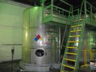 Used Saracco Tank & Mfg Approximately 5,200 Gallon Stainless Steel Storage Tank. Approximately 9' diameter x 11' straight side. Flat bottom and slight cone top. Various top openings including a 17
