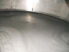 Used Saracco Tank & Mfg Approximately 5,200 Gallon Stainless Steel Storage Tank. Approximately 9' diameter x 11' straight side. Flat bottom and slight cone top. Various top openings including a 17