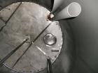 Used Saracco Tank & Mfg Approximately 5,200 Gallon Stainless Steel Storage Tank. Approximately 9' diameter x 11' straight side. Flat bottom and slight cone top. Various top openings including a 17