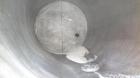 Used Walker Stainless Tank, 5000 Gallon, Model 9559, 304 Stainless Steel, Vertical. Approximately 96” diameter x 164” straight side, dished top, sloped bottom. Openings: top (2) 1-1/4” NPT, 2