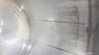 Used Walker Stainless Tank, 5000 Gallon, Model 9560, 304 Stainless Steel, Vertical. Approximate 120” diameter x 104” straight side, dished top, sloped bottom. Openings top (2) 3” NPT, 18” man way wit...