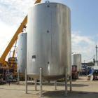 Used- Walker 5000 Gallon 304 Stainless Steel Vertical Tank. This tank has a dome top and a dish bottom. The tank diameter is...