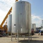 Used Walker 5000 Gallon 304 Stainless Steel Vertical Tank. This tank has a dome top and a dish bottom. The tank diameter is 102