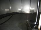 Used Walker Stainless 10,000 Gallon top agitated stainless steel single wall mixing tank.  Bottom side manway, dish top and bottom, (2) sets of mixing blades, dual CIP spray ball, thermometer, 3
