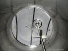 Used Walker Stainless 10,000 Gallon top agitated stainless steel single wall mixing tank.  Bottom side manway, dish top and bottom, (2) sets of mixing blades, dual CIP spray ball, thermometer, 3