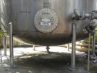 Used Walker Storage Tank, 16,000 Gallon, 316L stainless steel, vertical. Approximate 12' diameter x 18' straight side, dish top and bottom. Misc top and side flanged openings. Side openings include a...