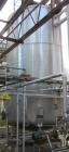 Used Walker Storage Tank, 16,000 Gallon, 316L stainless steel, vertical. Approximate 12' diameter x 18' straight side, dish top and bottom. Misc top and side flanged openings. Side openings include a...