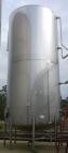 Used Walker Storage Tank, Model SS, 21,000 gallon, 304L stainless steel, vertical. Approximate 12' diameter x 24' straight side, dish top and bottom. Top openings include an 18