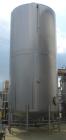 Used Walker Storage Tank, Model SS, 21,000 gallon, 304L stainless steel, vertical. Approximate 12' diameter x 24' straight side, dish top and bottom. Top openings include an 18