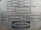 Used Walker Storage Tank, Model SS, 21,000 gallon, 304L stainless steel, vertical. Approximate 12' diameter x 24' straight side, dish top and bottom. Top openings include an 18
