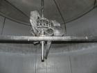 Used Walker Stainless Tank, 8500 Gallon, 304 Stainless Steel, Vertical. Approximate 132” diameter x 144” straight side, coned top, flat bottom. Top entering disperser, approximate 1-1/2” diameter x 8...