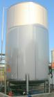 USED: Walker 16,200 gallon, type 304L stainless steel storage tank. Vertical, dished heads. Approximately 12' diameter x 18' straight side. Misc top openings. Side openings include an 18