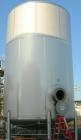 USED: Walker 16,200 gallon, type 304L stainless steel storage tank. Vertical, dished heads. Approximately 12' diameter x 18' straight side. Misc top openings. Side openings include an 18