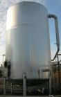 USED: Walker 16,200 gallon, type 304L stainless steel storage tank. Vertical, dished heads. Approximately 12' diameter x 18' straight side. Misc top openings. Side openings include an 18