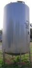 USED: Walker 5,000 gallon, type 304L stainless steel, storage tank. Vertical, dished heads. Approximate 8' diameter x 12' straight side. Misc top and side flanged openings. Bottom has a 2