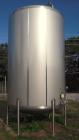 USED: Walker 5,000 gallon, type 304L stainless steel, storage tank. Vertical, dished heads. Approximate 8' diameter x 12' straight side. Misc top and side flanged openings. Bottom has a 2