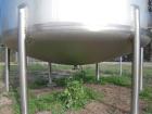 USED: Walker 5,000 gallon, type 304L stainless steel, storage tank. Vertical, dished heads. Approximate 8' diameter x 12' straight side. Misc top and side flanged openings. Bottom has a 2